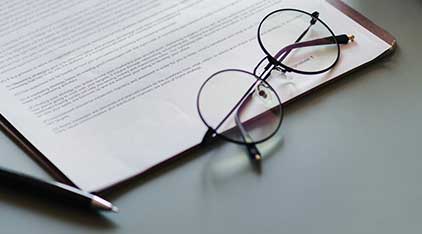 glasses next to a book