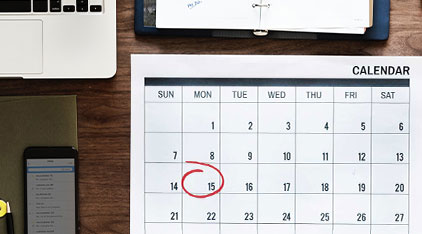 desk calendar with the 15th circled